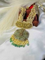 Antique stone pendant featuring intricate 22K gold inlay work