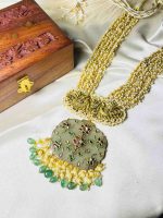 Antique stone ornament featuring intricate 22K gold inlay work