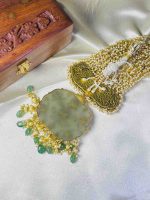Antique stone ornament featuring intricate 22K gold inlay work
