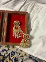 Lightweight 22K gold earrings showcasing diamond polki craftsmanship