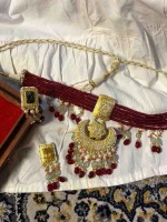 Lightweight gold ornament featuring traditional diamond polki work
