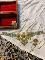 Lightweight 22K gold jewellery adorned with natural diamond polkis