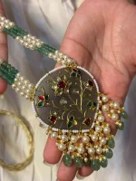 Traditional antique stone pendal with detailed gold inlay work