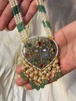 Traditional antique stone ornament with detailed gold inlay work