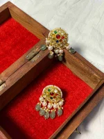 Natural diamond polkis beautifully detailed on lightweight 22K gold earrings